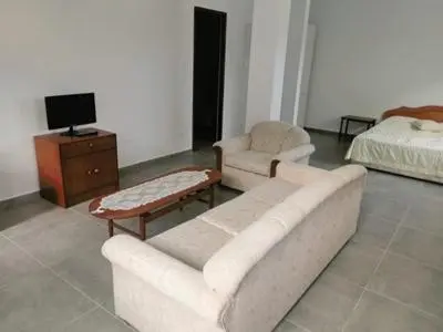 a living room with a couch and a bed at lomez House in Amman