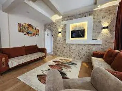 a living room with a couch and a rug at Jordan House INN in Amman