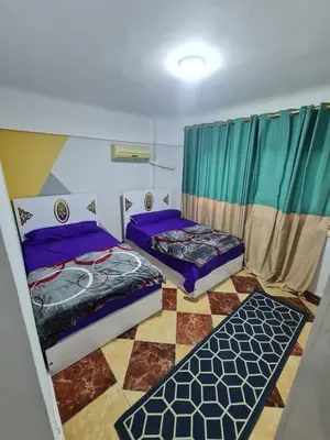 a room with two beds in a room at La bedouin in Amman