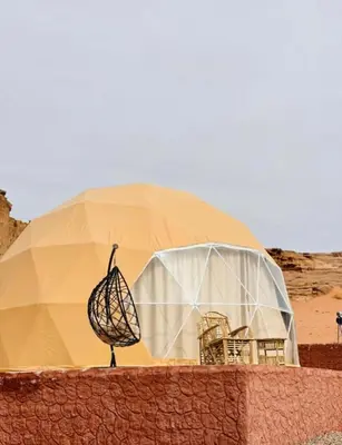 a dome tent in the middle of the desert at Wadi Rum Luxure desert Camp in Wadi Rum