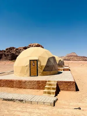 a tent in the middle of the desert at Wadi Rum Luxure desert Camp in Wadi Rum