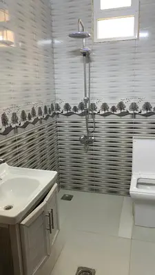 a bathroom with a shower and a sink at شاليه جبال سوف in Jerash