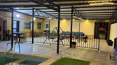 a room with a swimming pool and a fence at شاليه جبال سوف in Jerash