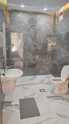 a bathroom with a toilet and a sink at Ayla Chalets in Amman