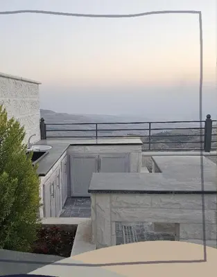 a view of the ocean from a building with a balcony at Ayla Chalets in Amman