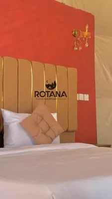 a bed with a sign on the side of it at Rotana luxury camp in Wadi Rum