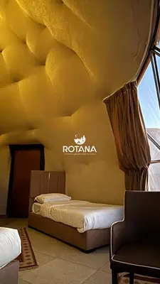 a room with a bed and a sign on the ceiling at Rotana luxury camp in Wadi Rum