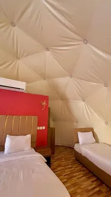a room with two beds in a tent at Diamond luxury rum in Wadi Rum