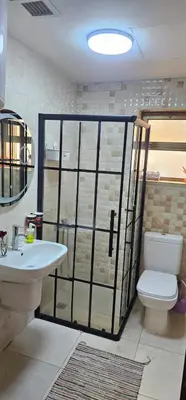 a bathroom with a toilet and a sink at 2 bedrooms apartment no 13 in Amman