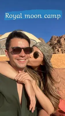 a man and a woman posing for a picture at ROYAL MOON BUBBLES lUXURY CAMP in Wadi Rum