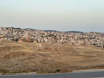 a view of a city from the side of a road at زهرة المدائن in Jerash