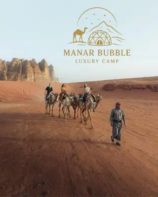 a group of people riding horses in the desert at Manar Bubbel Luxury Camp in Wadi Rum