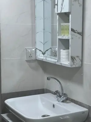a bathroom with a sink and a mirror at MOON RUM lUXURY CAMP in Wadi Rum