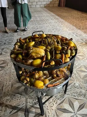a large tray of food on a table with lemons at MOON RUM lUXURY CAMP in Wadi Rum