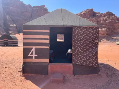 a small building in the middle of the desert at Um sabatah camp in Wadi Rum