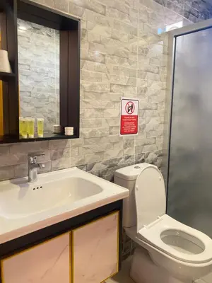a bathroom with a toilet and a sink at Ram Al-Umda Luxury Camp in Wadi Rum