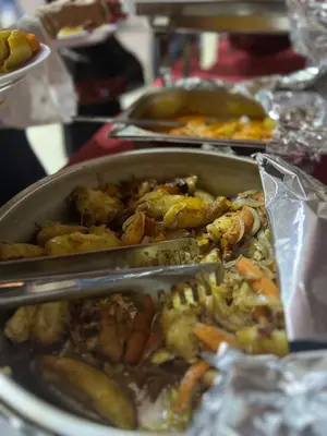 a table with a pan of food on a table at Royal Dunes Camp in Wadi Rum