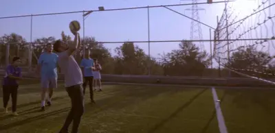 a group of people playing a game of volleyball at Tallet falastin in Umm Juraysāt
