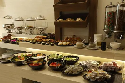 a buffet line with many different types of food at G Hotel Amman in Amman
