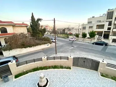 a view of a city street with a parking lot at Apartment in Amman Abdoun area in Amman