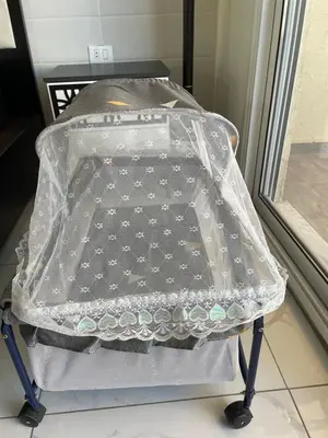 a suitcase with a plastic covering on a table at Modern Rooftop apartment in Amman