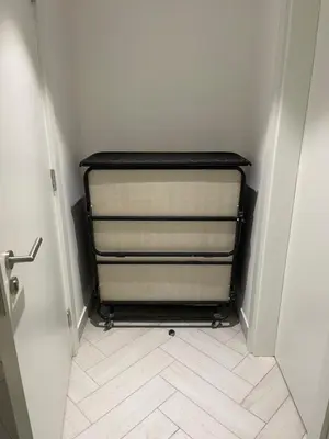 a hallway with a towel rack in a room at Ayla Apartment in Aqaba