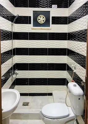 a bathroom with a toilet and a sink at روابي عجلون منزل in Ajloun
