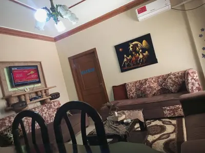 a living room with a couch and a table at luxury house in Madaba