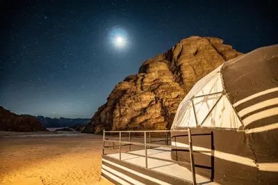 a dome tent in the desert at night at Aladdin Camp in Disah