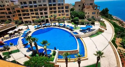 an overhead view of a swimming pool at a resort at F36 Samarah Resort Apartment in Sowayma