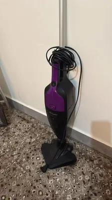 a black and purple blender sitting next to a wall at Cozy Flat, Amman Airport in Amman