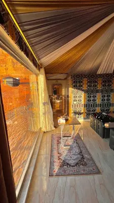a room with a table in the middle of a room at RUM MARTiN BUBBLES lUXURY CAMP in Wadi Rum