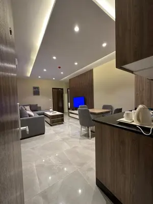 a living room with a couch and a table at Chic Apartments For Rent ave2-2 in Amman