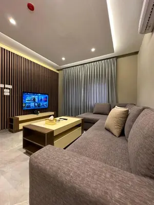 a living room with a couch and a flat screen tv at Chic Apartments For Rent ave2-5 in Amman