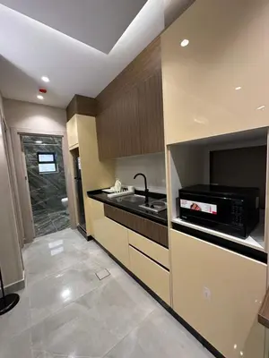 a kitchen with a sink and a microwave at Chic Apartments For Rent ave2-5 in Amman