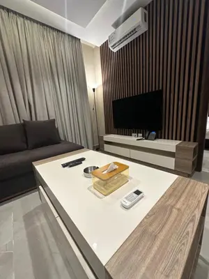 a living room with a couch and a table at Chic Apartments For Rent ave2-7 in Amman