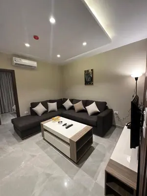 a living room with a couch and a coffee table at Chic Apartments For Rent ave2-8 in Amman
