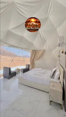 a bedroom with a large bed in a tent at RUM MARS VALLEY BUBBLE lUXURY CAMP in Wadi Rum