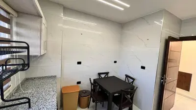 a small dining room with a table and chairs at شقة مفروشة فخمة بغرفتين نوم عمو سامي in Amman