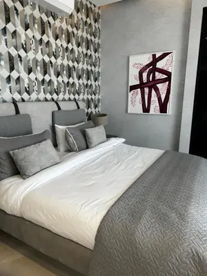 a bedroom with a large white bed in it at Beit Elhala Villa By Seahorse in Al Rama