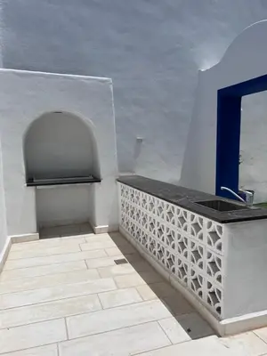 a bathroom with a sink and a counter top at The Greek Village - Cofru By Seahorse in Sowayma
