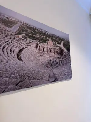 a picture of an amphitheater on a wall at 1 Antica Jabalal-lwebdeh in Amman