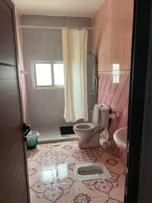 a bathroom with a toilet and a sink at Jarash in Jerash