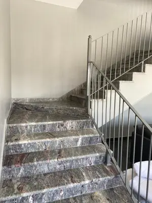 a set of stairs in an abandoned building at Makanak Villas in Jerash