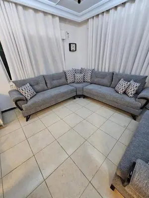 a living room with a couch in a room at soon inn in Petra