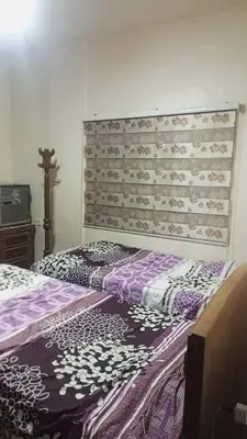 two beds sitting next to each other in a room at soon inn in Petra