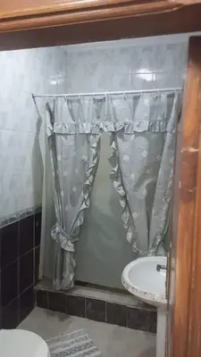 a bathroom with a shower curtain and a sink at soon inn in Petra