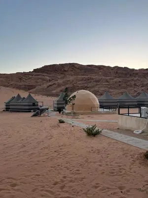 a group of tents in the middle of the desert at Magic mountains rum in Wadi Rum