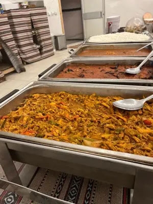 a bunch of food in trays in a kitchen at RADISSON lUXURY RUM CAMP in Wadi Rum