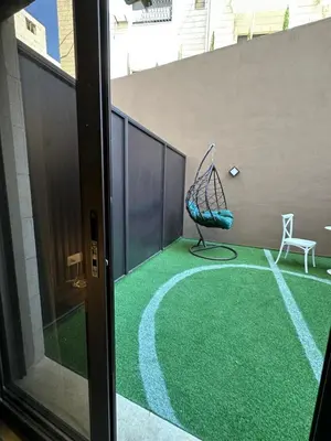 a balcony with a net on the floor of a building at Chic Apartments For Rent ave0-3 in Amman